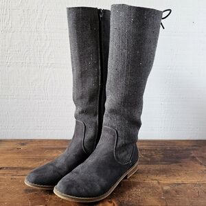 Tall riding style boots, dark gray suede and herringbone fabric.